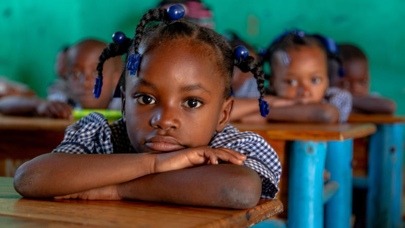 Child in Haiti sitting at desk at school